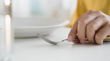 Hand holding fork