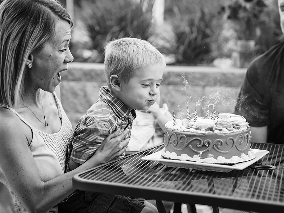 Child blowing out candles