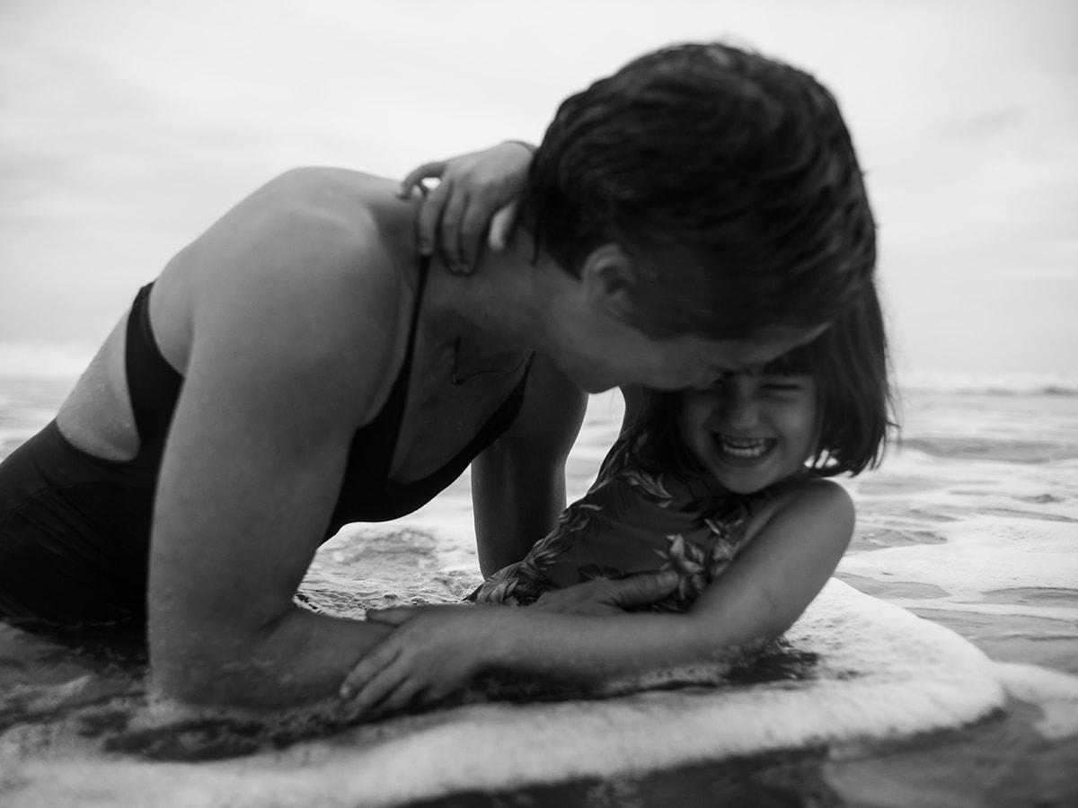 Woman with child in water