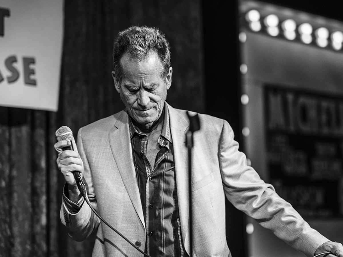 Man on stage with microphone