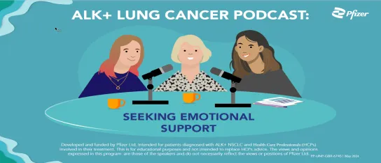 Three ladies sitting around a table with a microphone.