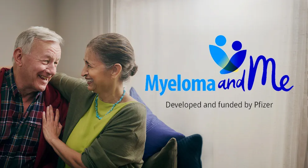 Man and woman sitting on a sofa together talking