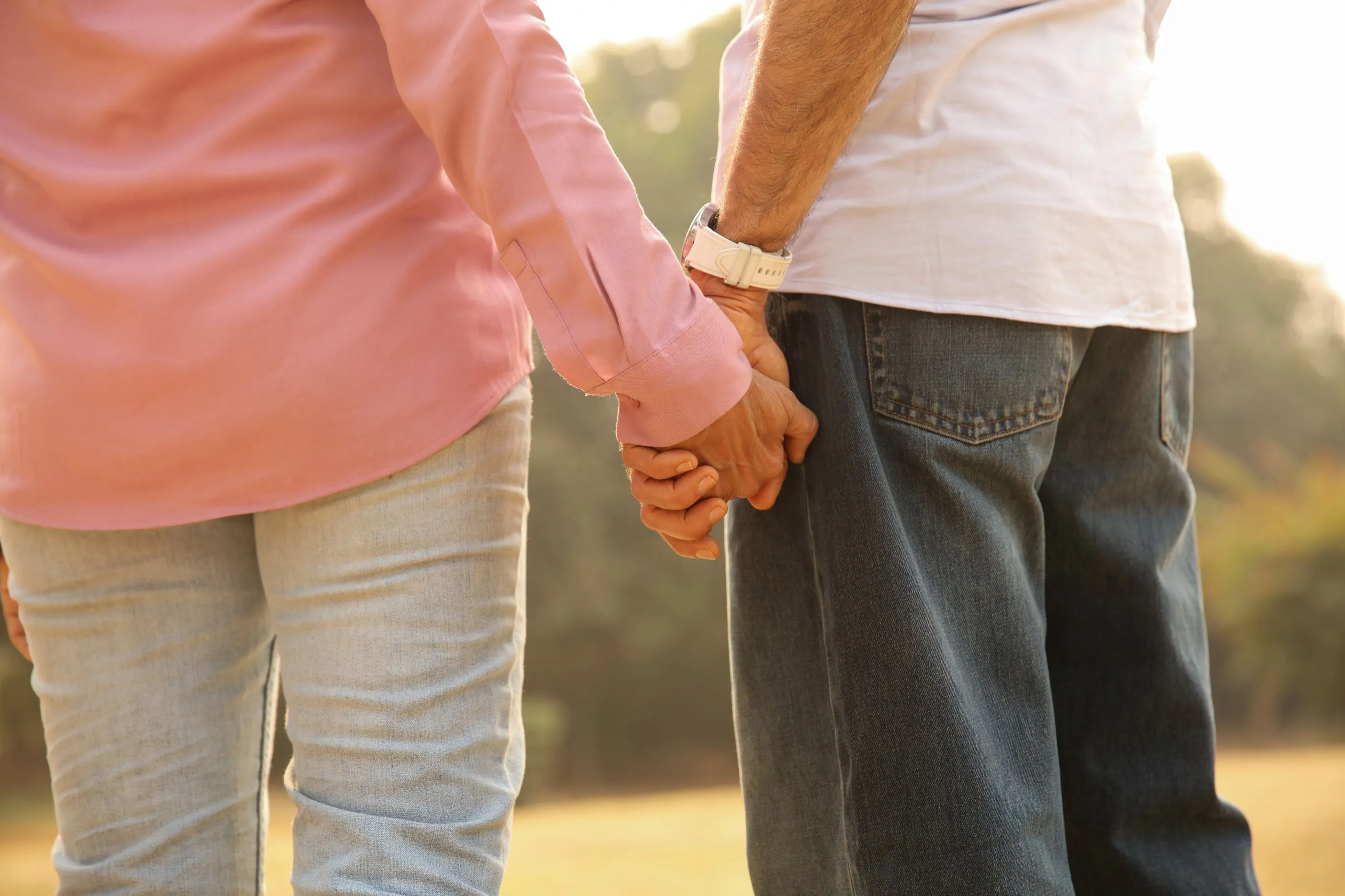 Man and women holding hands