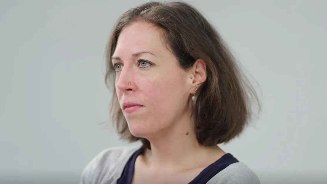 Katie looking away from the camera at an angle. 