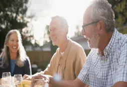 3 people eating in the sunshine
