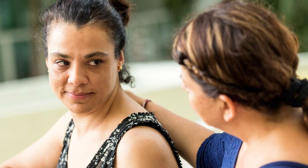 A women comforting another women